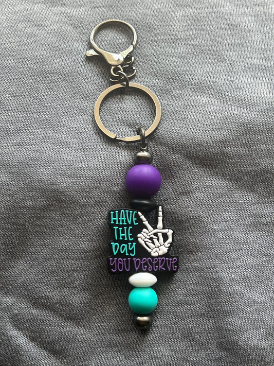 Have The Day You Deserve Keychain