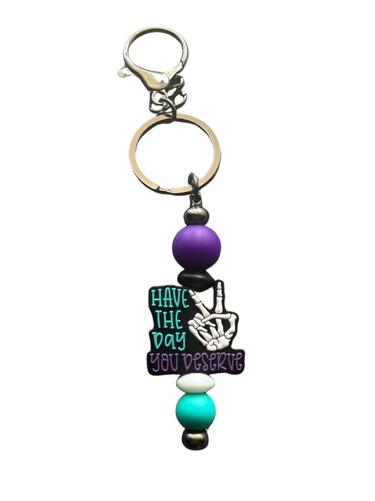“Have The Day You Deserve” Keychain.